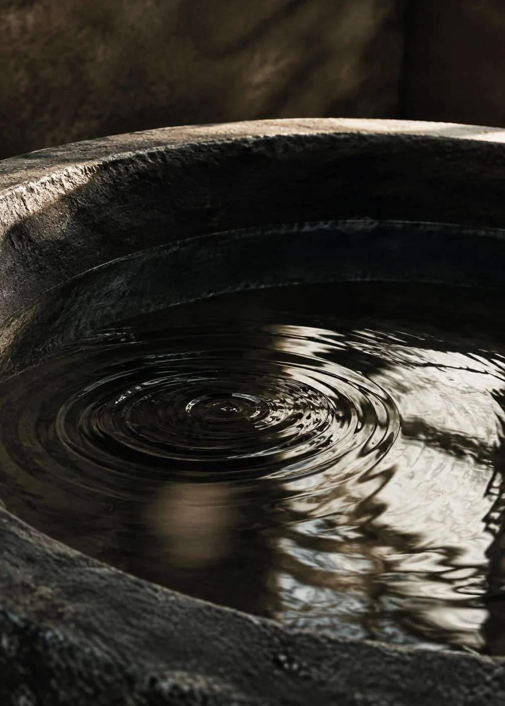 Ripples in a quiet stone basin